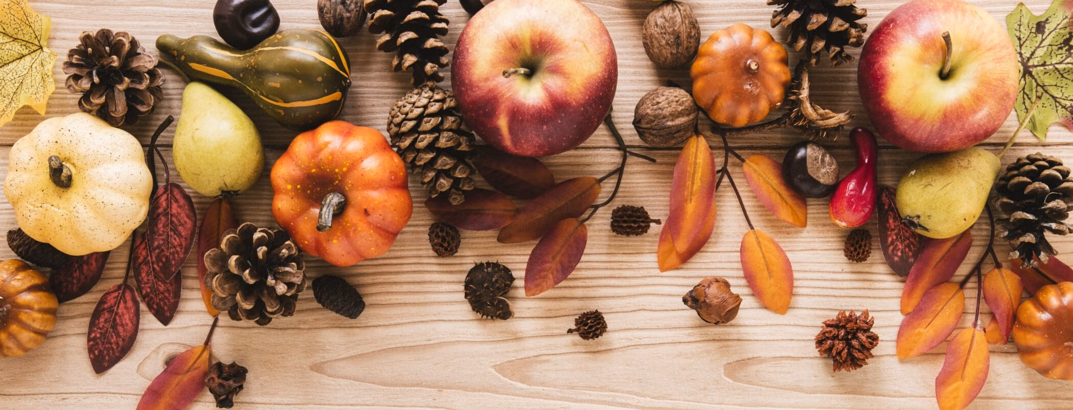 top-view-autumn-food-with-wooden-background-1-2100x804